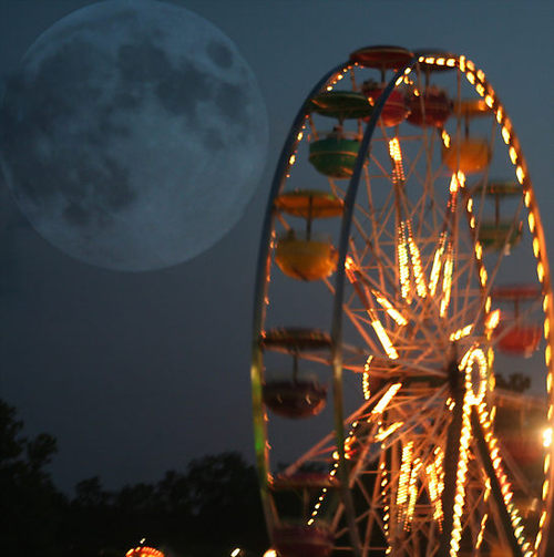 ferris wheel with large moon